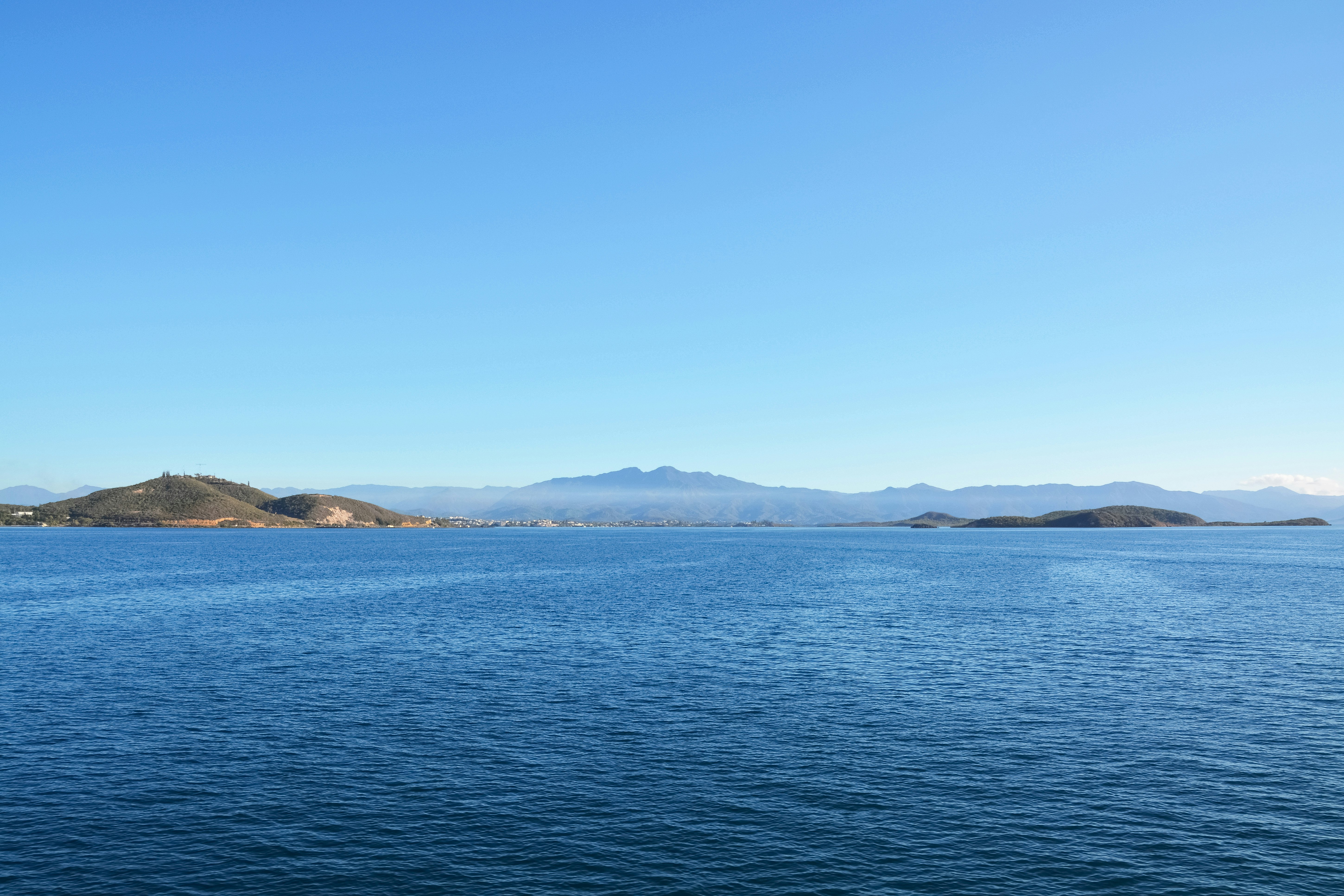 blue sea under blue sky during daytime